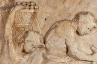 Relief with satyrs crushing grapes